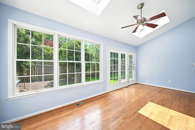 10861 Hunter Gate Way, Reston, VA 20194 - spare room featuring a skylight, wood finished floors, lofted ceiling, and a ceiling fan