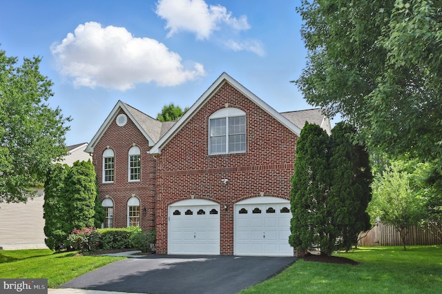 10861 Hunter Gate Way, Reston, VA 20194 - view of front of house with driveway, brick siding, an attached garage, and a shingled roof