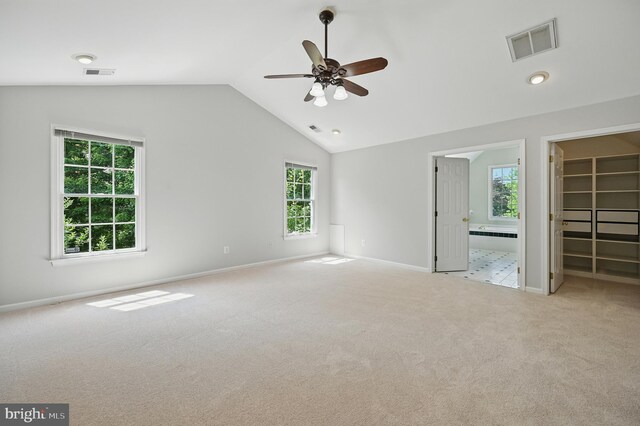 10861 Hunter Gate Way, Reston, VA 20194 - unfurnished bedroom featuring a walk in closet, carpet floors, vaulted ceiling, connected bathroom, and ceiling fan