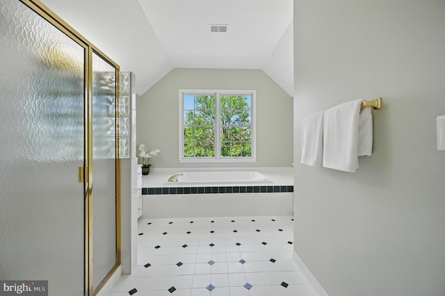 10861 Hunter Gate Way, Reston, VA 20194 - bathroom with tile patterned flooring, a garden tub, a stall shower, and vaulted ceiling