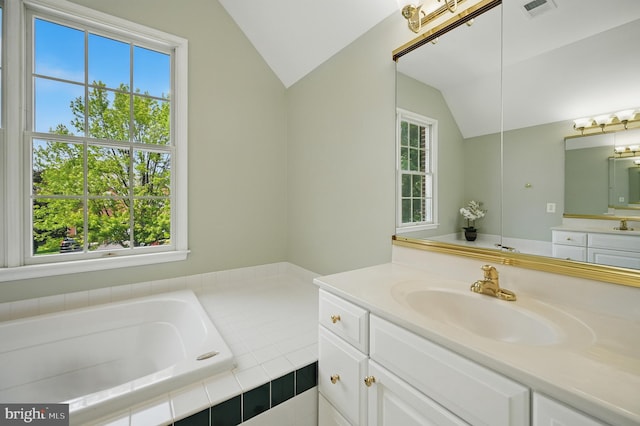 10861 Hunter Gate Way, Reston, VA 20194 - bathroom with vaulted ceiling, vanity, and a garden tub