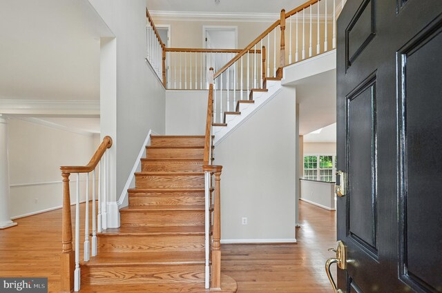 10861 Hunter Gate Way, Reston, VA 20194 - staircase with wood finished floors and ornamental molding