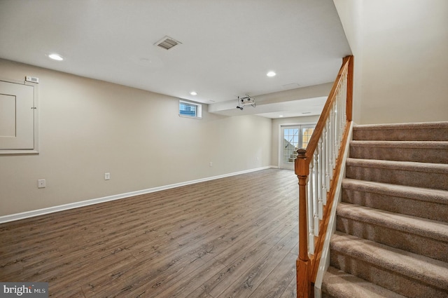 10861 Hunter Gate Way, Reston, VA 20194 - basement featuring recessed lighting, wood finished floors, and stairway