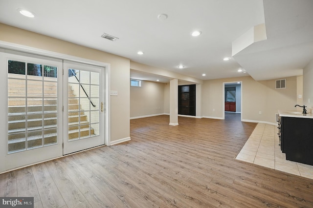 10861 Hunter Gate Way, Reston, VA 20194 - unfurnished living room with light wood-type flooring and recessed lighting