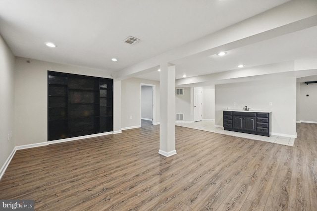 10861 Hunter Gate Way, Reston, VA 20194 - unfurnished living room with light wood finished floors, recessed lighting, and bar