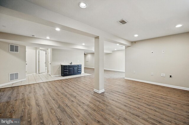 10861 Hunter Gate Way, Reston, VA 20194 - finished below grade area with light wood-style floors and recessed lighting