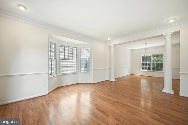 10861 Hunter Gate Way, Reston, VA 20194 - empty room with decorative columns, crown molding, wood finished floors, and a chandelier