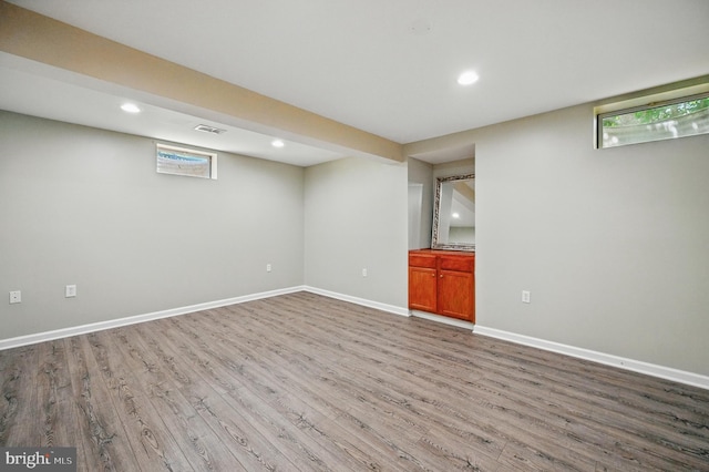 10861 Hunter Gate Way, Reston, VA 20194 - below grade area featuring wood finished floors, recessed lighting, and healthy amount of natural light