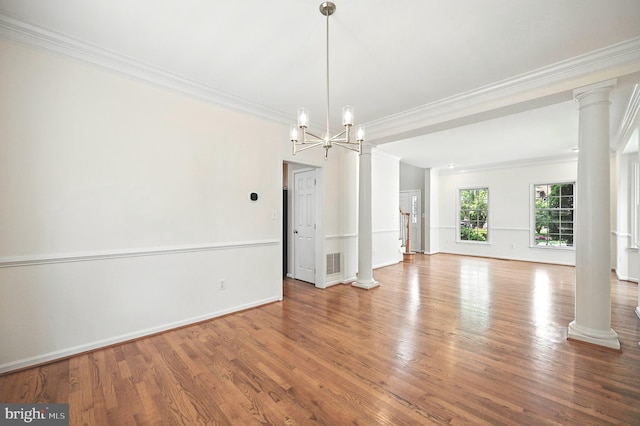 10861 Hunter Gate Way, Reston, VA 20194 - spare room featuring ornamental molding, wood finished floors, a chandelier, and ornate columns