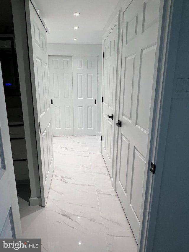 307 Yoakum Pkwy Unit 1801, Alexandria, VA 22304 - hallway featuring light marble finish flooring and recessed lighting