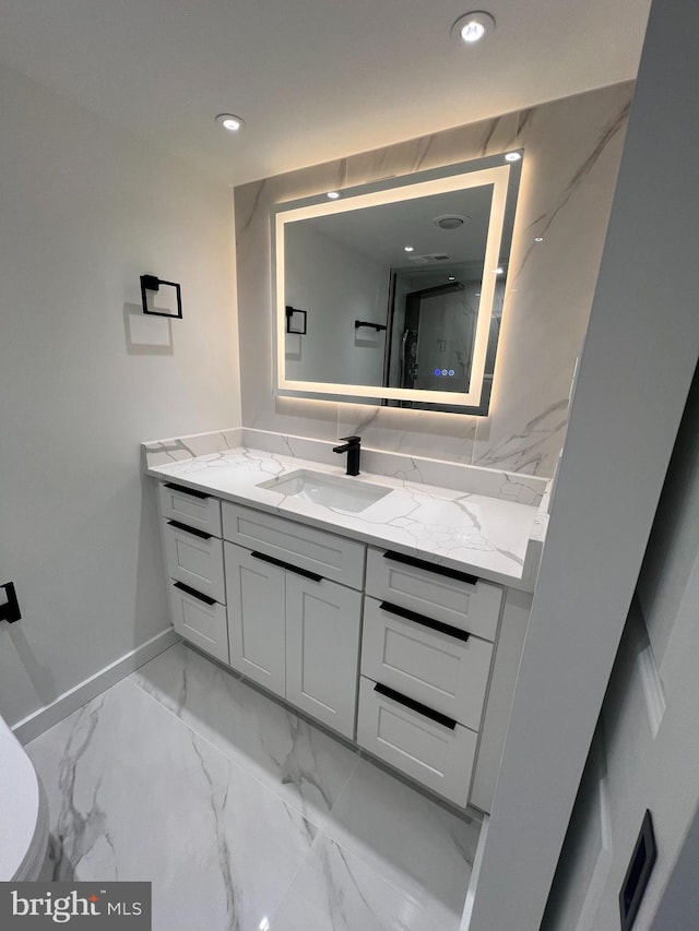 307 Yoakum Pkwy Unit 1801, Alexandria, VA 22304 - bathroom with vanity, baseboards, marble finish floors, toilet, and recessed lighting