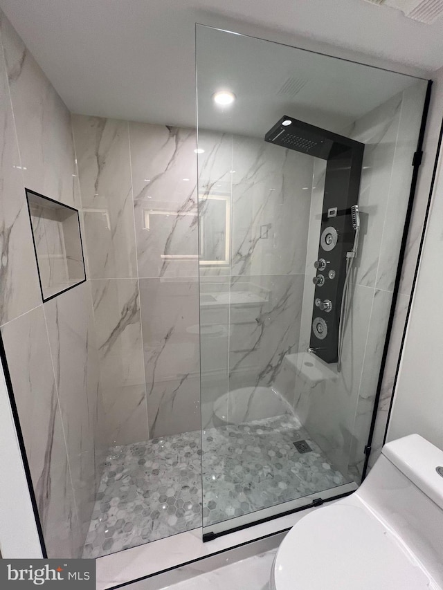 307 Yoakum Pkwy Unit 1801, Alexandria, VA 22304 - full bathroom featuring toilet and a marble finish shower