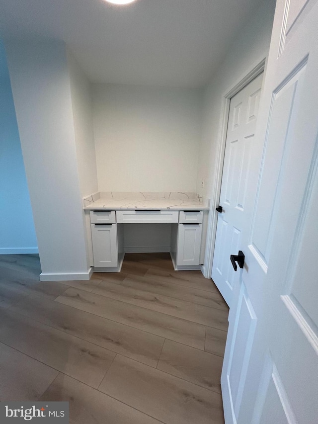 307 Yoakum Pkwy Unit 1801, Alexandria, VA 22304 - unfurnished office with built in desk, light wood-style flooring, and baseboards