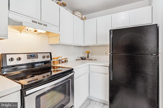 2630 Adams Mill Rd NW Unit 302, Washington, DC 20009 - kitchen with freestanding refrigerator, stainless steel electric stove, under cabinet range hood, and light countertops