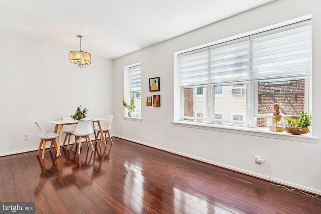 2630 Adams Mill Rd NW Unit 302, Washington, DC 20009 - dining space with dark wood-style flooring, baseboards, and a chandelier