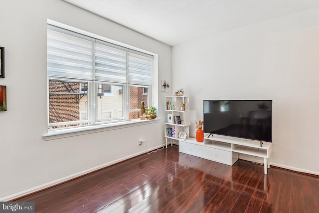 2630 Adams Mill Rd NW Unit 302, Washington, DC 20009 - living room featuring wood finished floors and baseboards