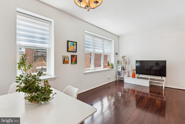 2630 Adams Mill Rd NW Unit 302, Washington, DC 20009 - living room with wood finished floors and baseboards