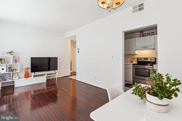2630 Adams Mill Rd NW Unit 302, Washington, DC 20009 - living room with wood finished floors and a chandelier
