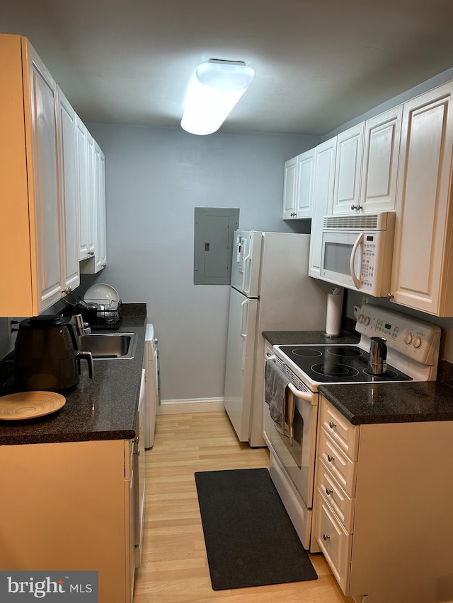 1005 Chillum Rd Unit 415, Hyattsville, MD 20782 - kitchen with white appliances, a sink, electric panel, light wood-type flooring, and baseboards