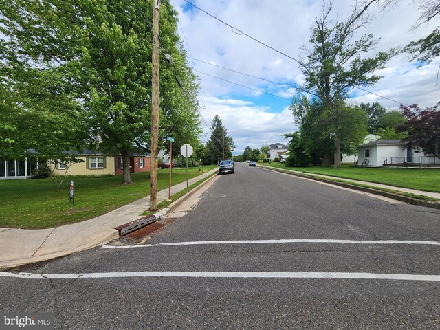 149 N Brentwood Ave, Pitman, NJ 08071 - view of asphalt street featuring sidewalks, curbs, and traffic signs