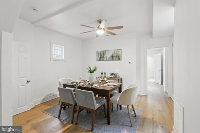 405 Calvin Ave, Baltimore, MD 21218 - dining space featuring light wood-style floors, a ceiling fan, and baseboards