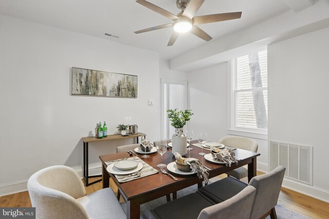 405 Calvin Ave, Baltimore, MD 21218 - dining space featuring a ceiling fan, light wood-style flooring, and baseboards