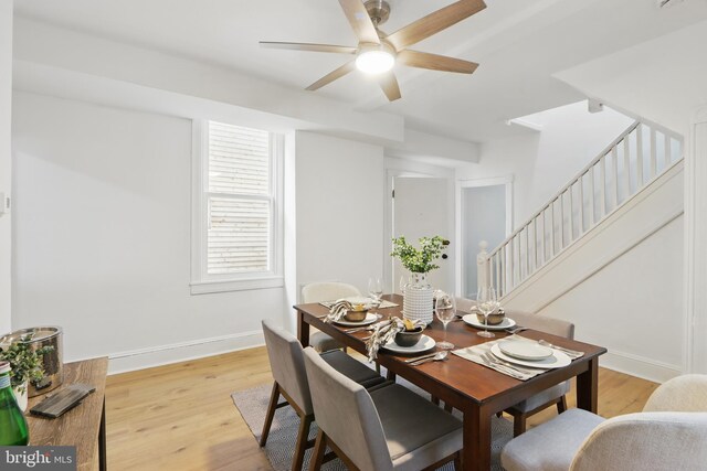 405 Calvin Ave, Baltimore, MD 21218 - dining area featuring ceiling fan, light wood-type flooring, stairs, and baseboards