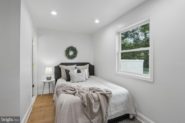 405 Calvin Ave, Baltimore, MD 21218 - bedroom with baseboards, wood finished floors, and recessed lighting