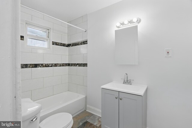 405 Calvin Ave, Baltimore, MD 21218 - bathroom with toilet, vanity, washtub / shower combination, and baseboards