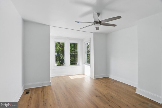 405 Calvin Ave, Baltimore, MD 21218 - unfurnished room featuring ceiling fan, wood finished floors, and baseboards