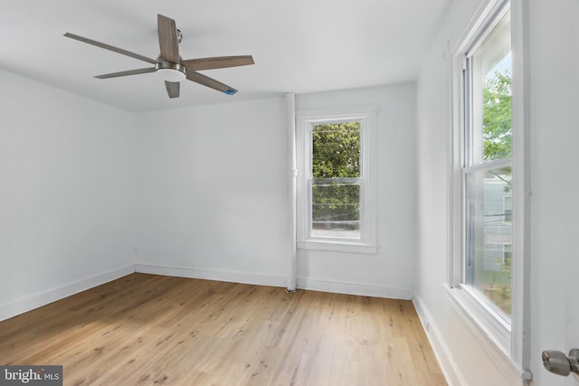 405 Calvin Ave, Baltimore, MD 21218 - unfurnished room featuring light wood-style flooring, baseboards, and a ceiling fan