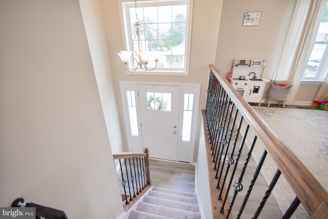 316 Pochards Ct, Martinsburg, WV 25403 - foyer featuring a chandelier, wood finished floors, stairway, and baseboards