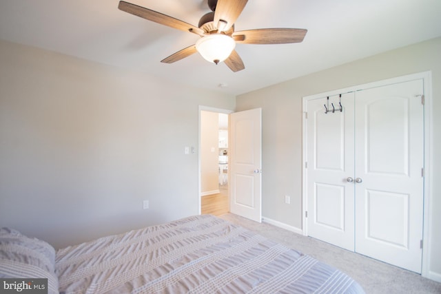 316 Pochards Ct, Martinsburg, WV 25403 - unfurnished bedroom featuring a closet, light colored carpet, baseboards, and a ceiling fan