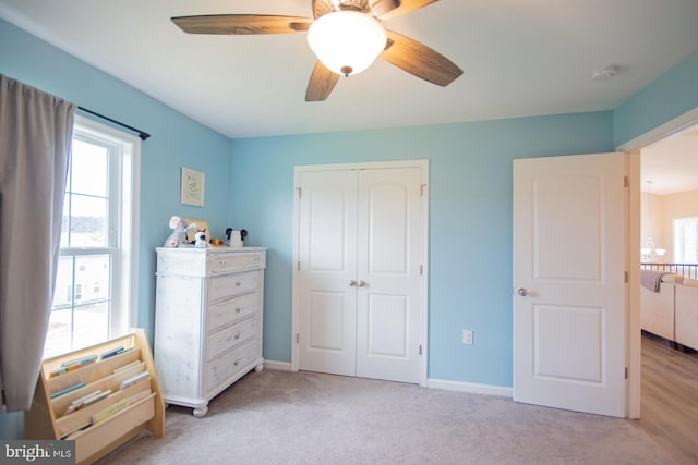 316 Pochards Ct, Martinsburg, WV 25403 - bedroom featuring a closet, light colored carpet, a ceiling fan, and baseboards