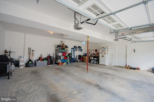 316 Pochards Ct, Martinsburg, WV 25403 - garage with freestanding refrigerator and a garage door opener