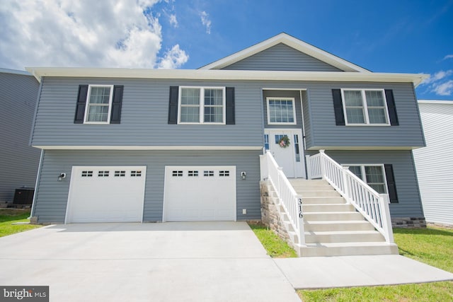 316 Pochards Ct, Martinsburg, WV 25403 - raised ranch featuring an attached garage, concrete driveway, and central AC unit