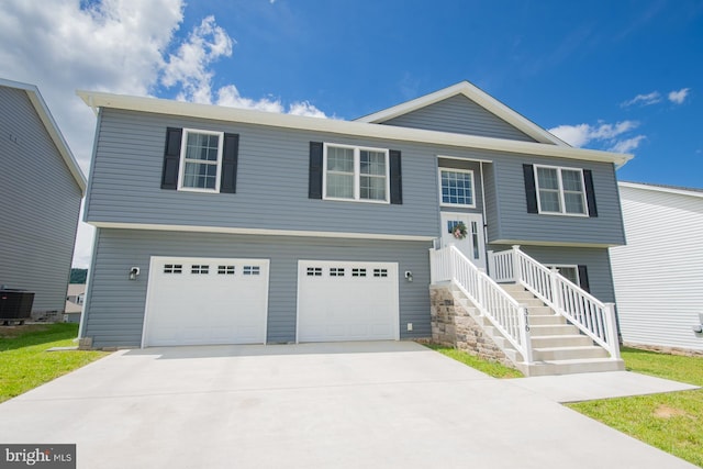 316 Pochards Ct, Martinsburg, WV 25403 - bi-level home with an attached garage, central AC, and concrete driveway