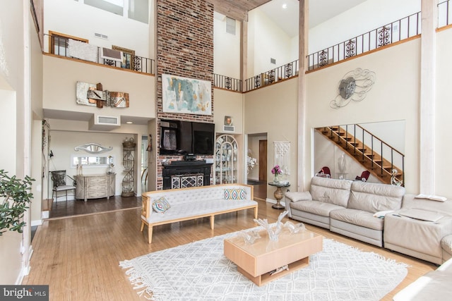 2500 Edge Hill Rd, Huntingdon Valley, PA 19006 - living room with high vaulted ceiling, stairway, wood finished floors, and baseboards