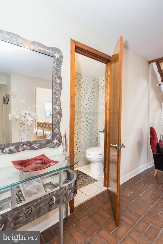 2500 Edge Hill Rd, Huntingdon Valley, PA 19006 - bathroom with toilet, brick patterned floors, and baseboards