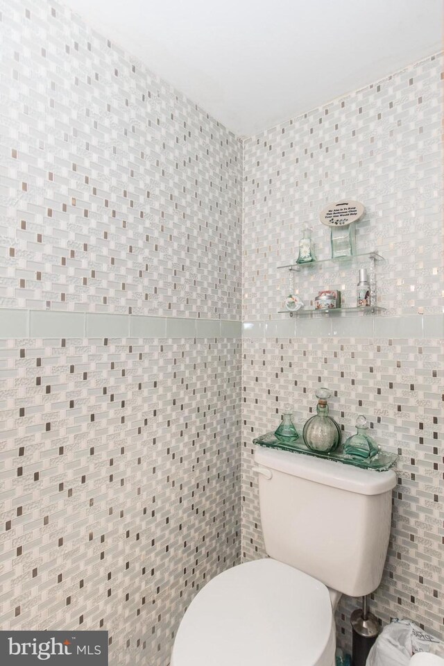 2500 Edge Hill Rd, Huntingdon Valley, PA 19006 - half bathroom with tile walls and toilet
