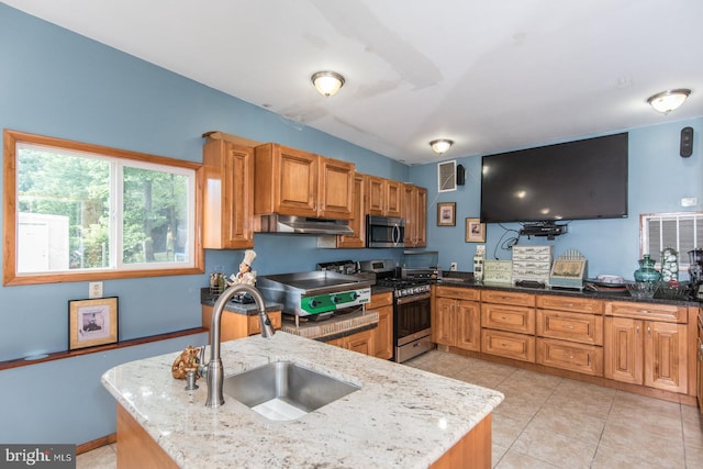 2500 Edge Hill Rd, Huntingdon Valley, PA 19006 - kitchen featuring stainless steel appliances, a sink, under cabinet range hood, light stone countertops, and light tile patterned flooring