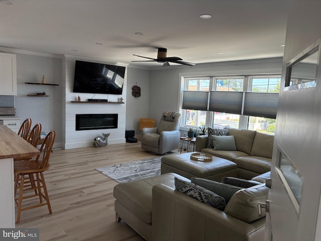 4112 Park Blvd Unit G, Wildwood, NJ 08260 - living room with ornamental molding, light wood finished floors, a large fireplace, ceiling fan, and baseboards