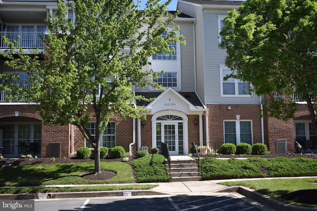 5236 Millfield Rd Unit 5236, Baltimore, MD 21237 - view of building exterior with central AC and uncovered parking
