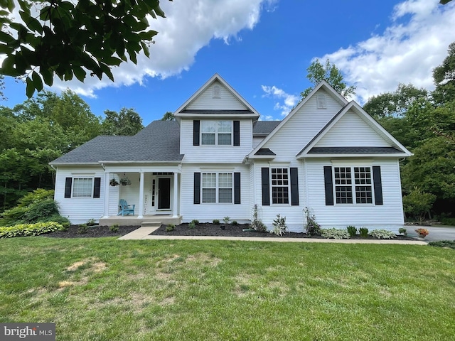 32 Misty Creek Ln, Fredericksburg, VA 22406 - traditional home with a front lawn, a porch, and roof with shingles