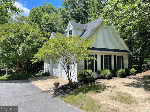 32 Misty Creek Ln, Fredericksburg, VA 22406 - view of front of house with concrete driveway, a shingled roof, and an attached garage