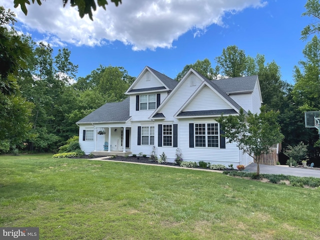 32 Misty Creek Ln, Fredericksburg, VA 22406 - traditional-style home with a front yard, roof with shingles, and a porch
