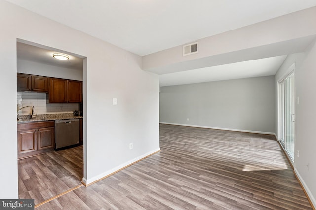 3807 Laramie Pl Unit 124C, Alexandria, VA 22309 - unfurnished living room with light wood finished floors and a sink