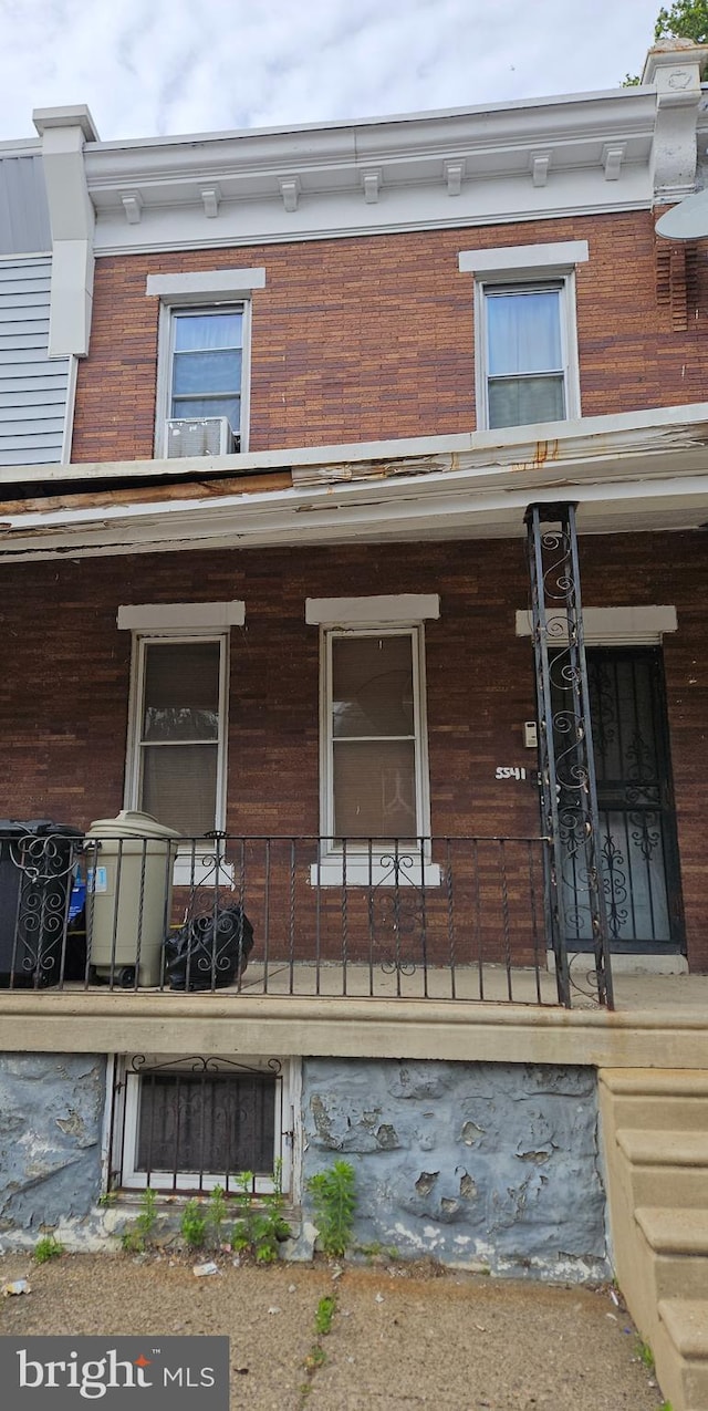 5541 Race St, Philadelphia, PA 19139 - doorway to property with covered porch and brick siding