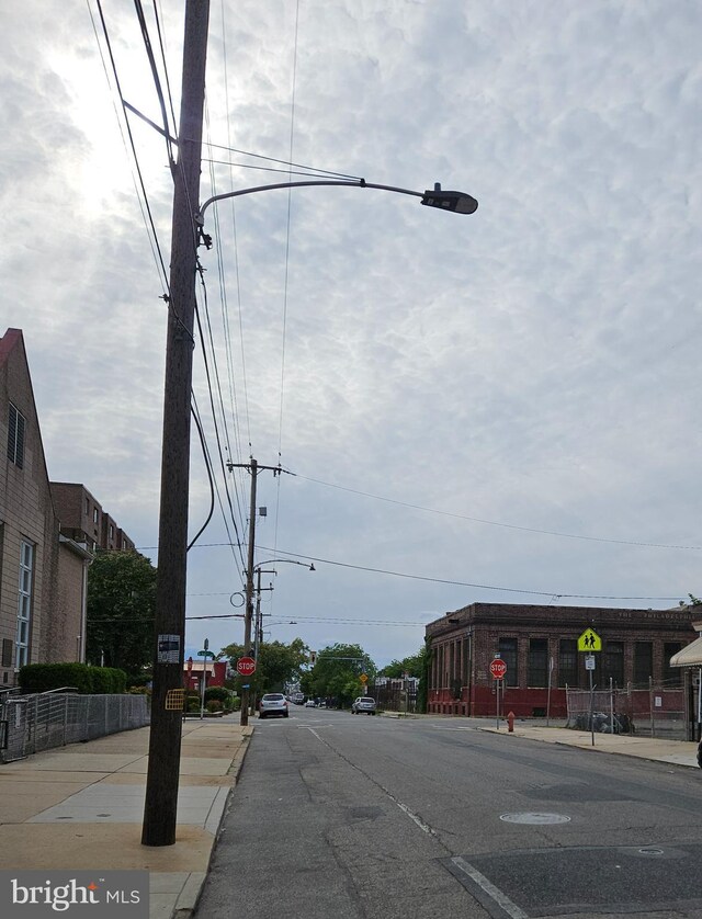 5541 Race St, Philadelphia, PA 19139 - view of asphalt street with traffic signs, sidewalks, street lighting, and curbs