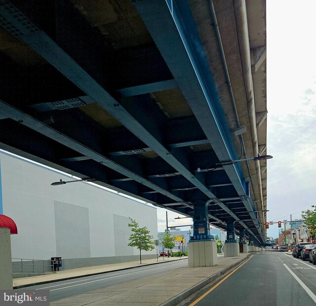 5541 Race St, Philadelphia, PA 19139 - view of asphalt street featuring traffic lights, street lighting, curbs, and sidewalks